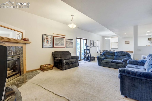 7850 Wilderness Dr, Colorado Springs, CO 80908 - carpeted living area featuring a chandelier and a premium fireplace