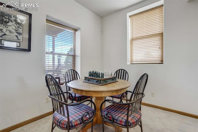 7850 Wilderness Dr, Colorado Springs, CO 80908 - dining room featuring light colored carpet and baseboards