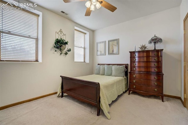 7850 Wilderness Dr, Colorado Springs, CO 80908 - bedroom with light carpet, baseboards, and a ceiling fan