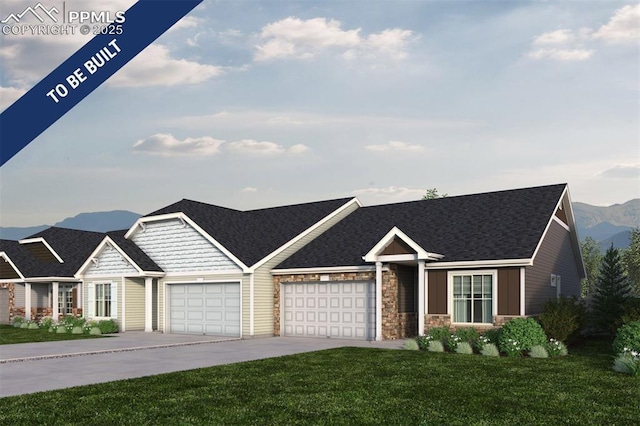 view of front of house featuring a shingled roof, a front lawn, a garage, a mountain view, and driveway