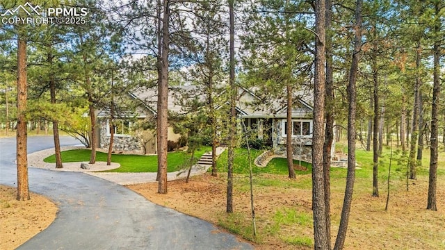 4415 Hidden Rock Rd, Colorado Springs, CO 80908 - view of community with driveway and a lawn