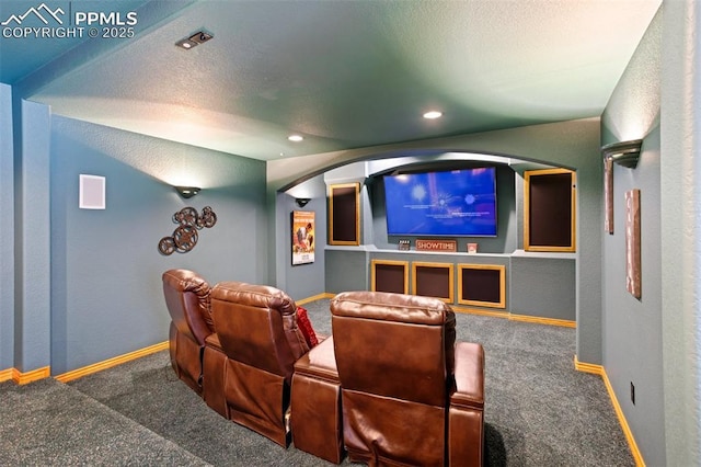 4415 Hidden Rock Rd, Colorado Springs, CO 80908 - cinema featuring carpet, arched walkways, baseboards, recessed lighting, and a textured ceiling