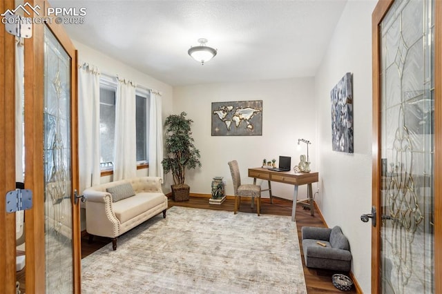 4415 Hidden Rock Rd, Colorado Springs, CO 80908 - office area with french doors, wood finished floors, and baseboards