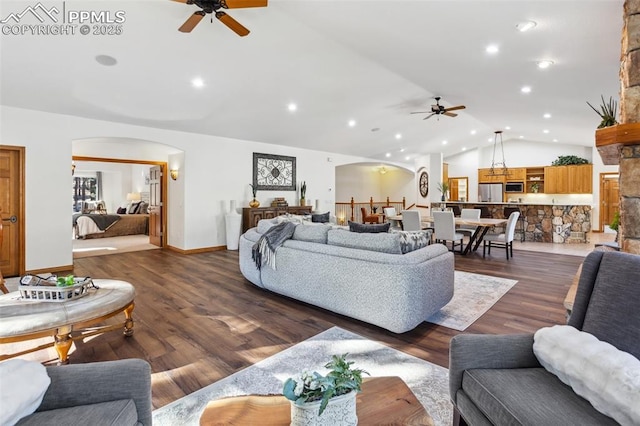 4415 Hidden Rock Rd, Colorado Springs, CO 80908 - living room featuring ceiling fan, arched walkways, vaulted ceiling, dark wood finished floors, and recessed lighting