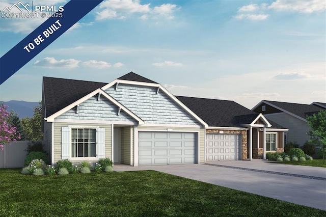 view of front facade featuring fence, an attached garage, a front yard, a mountain view, and driveway