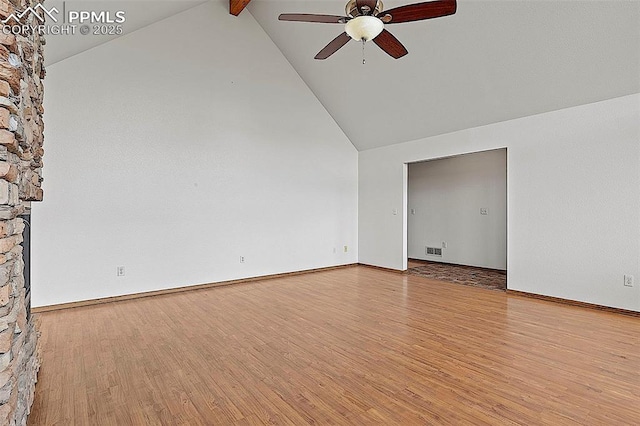 17880 Plains Edge Ct, Peyton, CO 80831 - spare room with visible vents, beam ceiling, wood finished floors, high vaulted ceiling, and a ceiling fan