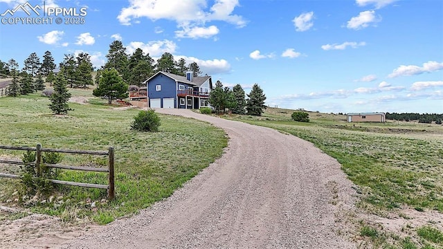 17880 Plains Edge Ct, Peyton, CO 80831 - surrounding community with a yard, fence, an attached garage, and driveway