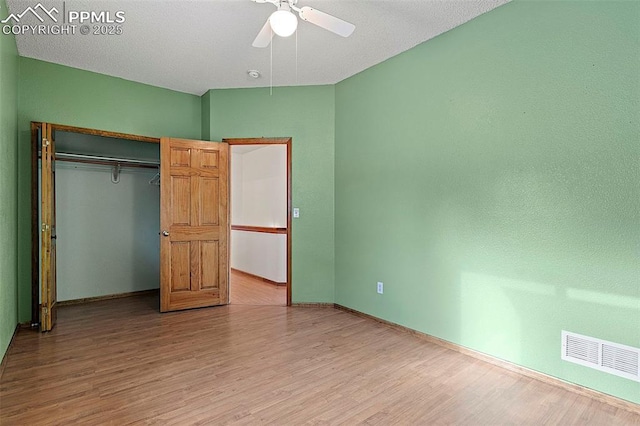 17880 Plains Edge Ct, Peyton, CO 80831 - unfurnished bedroom with ceiling fan, baseboards, wood finished floors, visible vents, and a closet