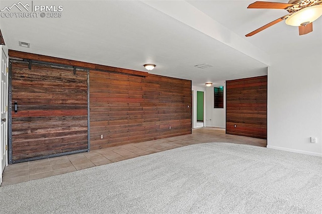 17880 Plains Edge Ct, Peyton, CO 80831 - empty room with light colored carpet, a ceiling fan, baseboards, and wood walls