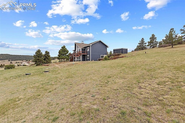 17880 Plains Edge Ct, Peyton, CO 80831 - view of yard with a deck and a rural view