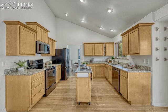 26 Mountain View Rd, Manitou Springs, CO 80829 - kitchen featuring stainless steel appliances, a kitchen island, light wood-style floors, high vaulted ceiling, and a sink