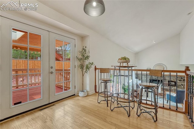 26 Mountain View Rd, Manitou Springs, CO 80829 - dining room featuring french doors, vaulted ceiling, and wood-type flooring