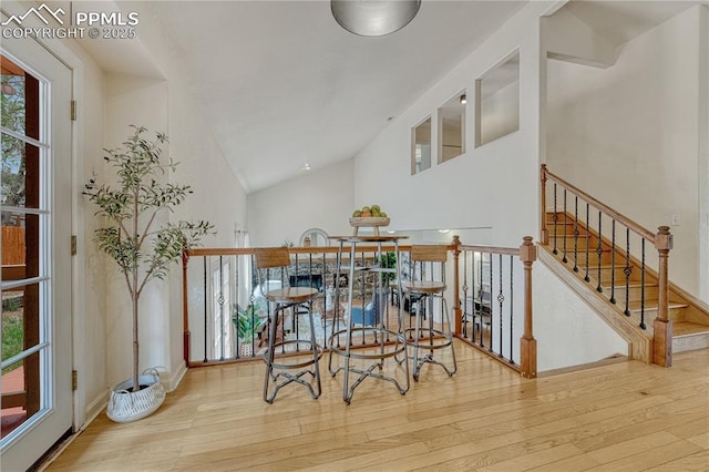 26 Mountain View Rd, Manitou Springs, CO 80829 - dining room with wood-type flooring, healthy amount of natural light, baseboards, and high vaulted ceiling