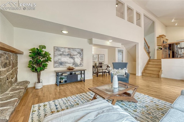 26 Mountain View Rd, Manitou Springs, CO 80829 - living room featuring stairs, wood finished floors, baseboards, and recessed lighting