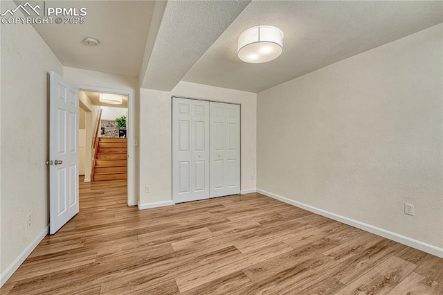 26 Mountain View Rd, Manitou Springs, CO 80829 - unfurnished bedroom featuring light wood-style floors, baseboards, and a closet