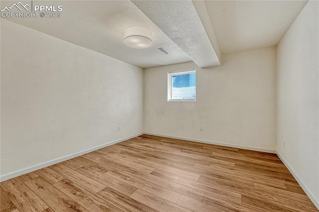 26 Mountain View Rd, Manitou Springs, CO 80829 - empty room featuring light wood-style floors, baseboards, and a textured ceiling