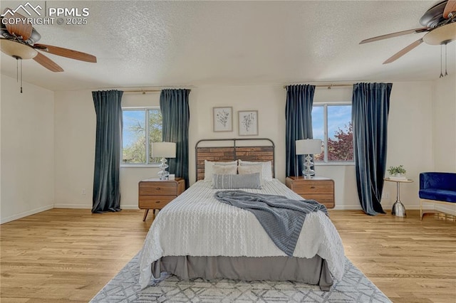 26 Mountain View Rd, Manitou Springs, CO 80829 - bedroom featuring wood finished floors, a textured ceiling, baseboards, and ceiling fan