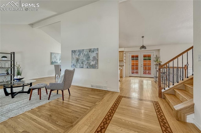 26 Mountain View Rd, Manitou Springs, CO 80829 - entrance foyer featuring french doors, hardwood / wood-style flooring, stairway, beamed ceiling, and baseboards