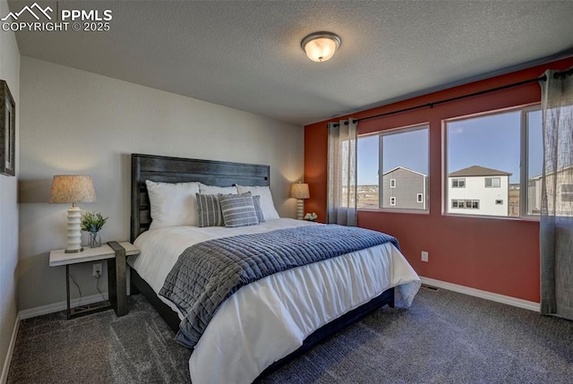 7352 Cornice Pt, Colorado Springs, CO 80923 - bedroom featuring carpet floors, baseboards, and a textured ceiling