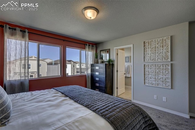 7352 Cornice Pt, Colorado Springs, CO 80923 - carpeted bedroom with baseboards, a textured ceiling, and cooling unit
