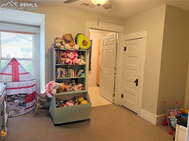 1322 Lincoln Ave, La Junta, CO 81050 - rec room featuring carpet, a ceiling fan, and visible vents