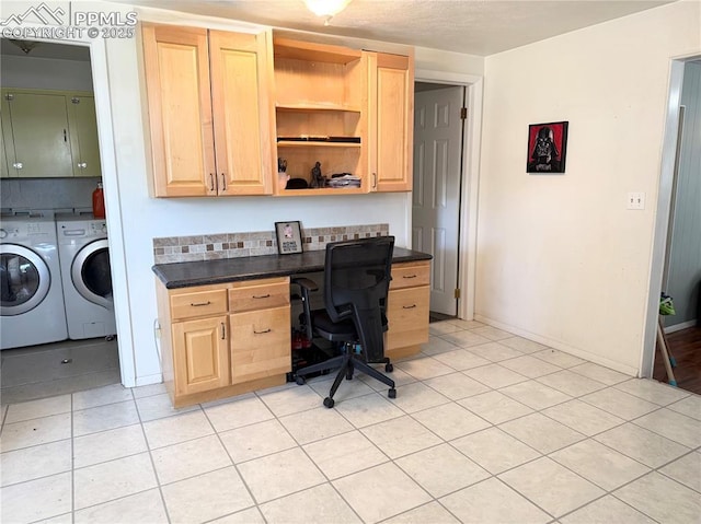 1322 Lincoln Ave, La Junta, CO 81050 - home office with light tile patterned floors, baseboards, built in desk, and independent washer and dryer