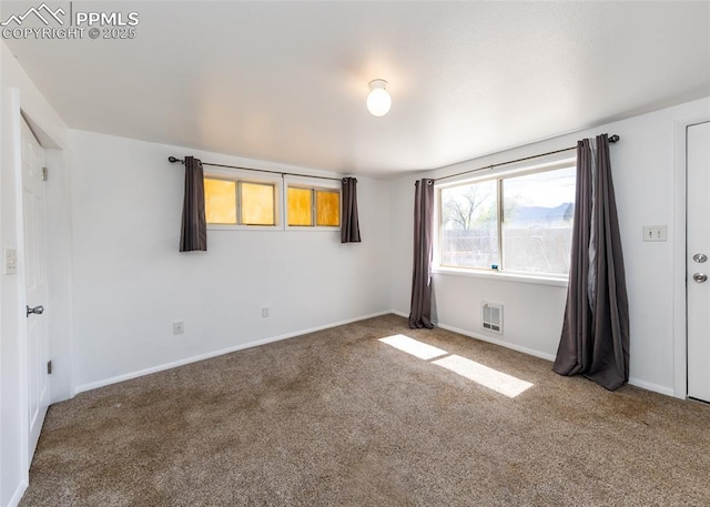 1328 E Las Animas St, Colorado Springs, CO 80910 - carpeted spare room with baseboards and visible vents