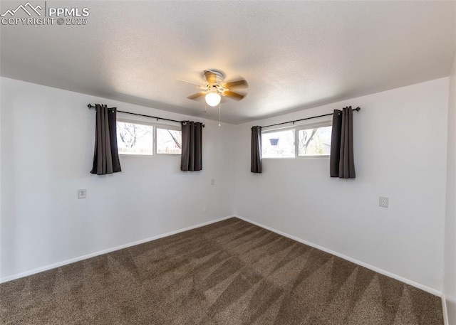 1328 E Las Animas St, Colorado Springs, CO 80910 - spare room with a ceiling fan, baseboards, a wealth of natural light, and dark carpet