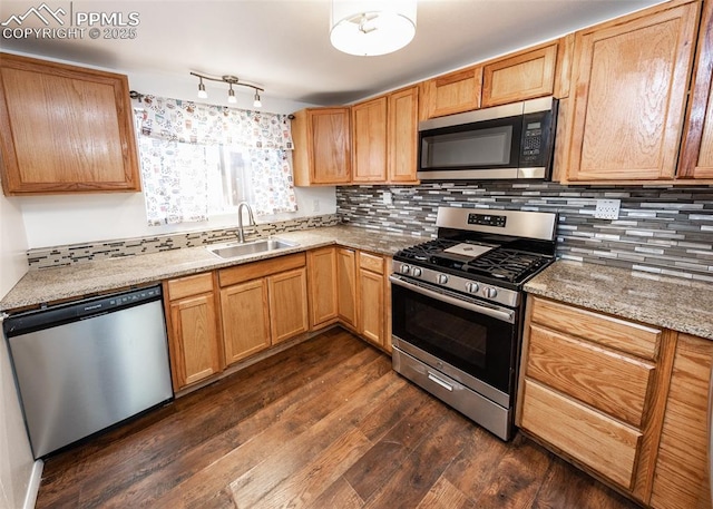 1328 E Las Animas St, Colorado Springs, CO 80910 - kitchen featuring light stone counters, a sink, dark wood finished floors, stainless steel appliances, and tasteful backsplash