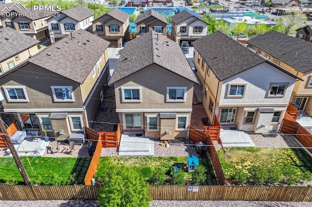835 Redemption Pt, Colorado Springs, CO 80905 - back of property featuring a fenced backyard, a patio area, and a residential view
