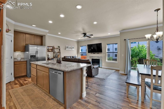 835 Redemption Pt, Colorado Springs, CO 80905 - kitchen featuring recessed lighting, a sink, ceiling fan with notable chandelier, wood finished floors, and stainless steel appliances
