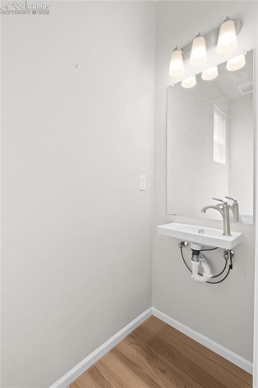bathroom featuring baseboards and wood finished floors