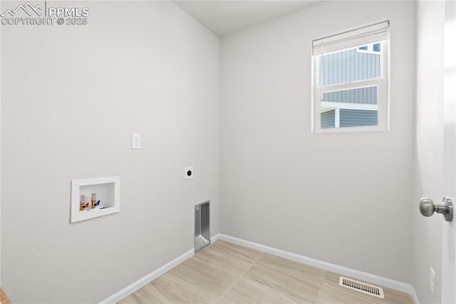 laundry room with baseboards, visible vents, washer hookup, laundry area, and electric dryer hookup