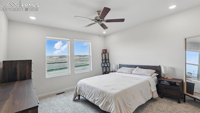 6555 Roundtail Way, Colorado Springs, CO 80925 - carpeted bedroom featuring baseboards, multiple windows, recessed lighting, and visible vents