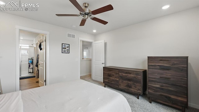6555 Roundtail Way, Colorado Springs, CO 80925 - bedroom featuring a ceiling fan, visible vents, ensuite bath, light carpet, and recessed lighting