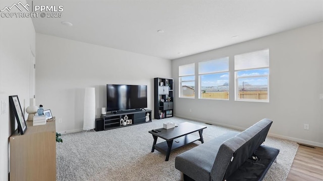 6555 Roundtail Way, Colorado Springs, CO 80925 - living room with baseboards and visible vents