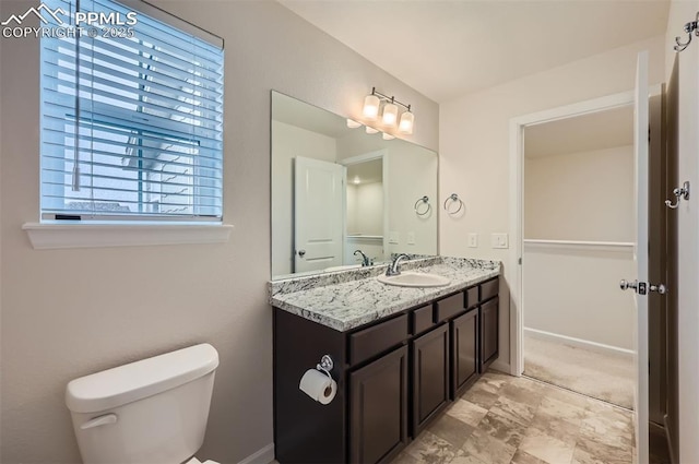 bathroom with toilet and vanity
