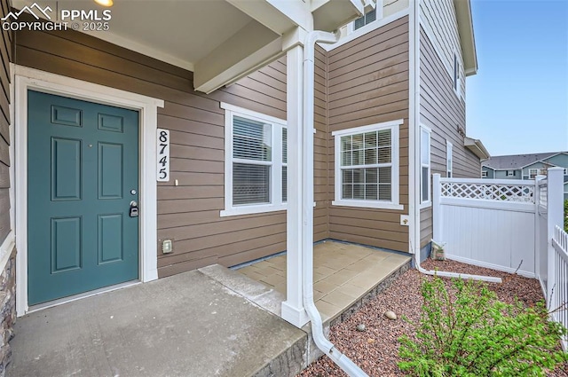 property entrance featuring fence
