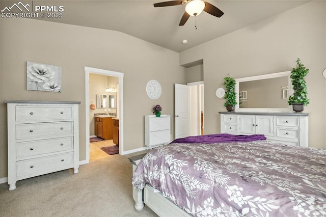 10842 Scenic Brush Dr, Peyton, CO 80831 - bedroom featuring light carpet, vaulted ceiling, baseboards, and connected bathroom