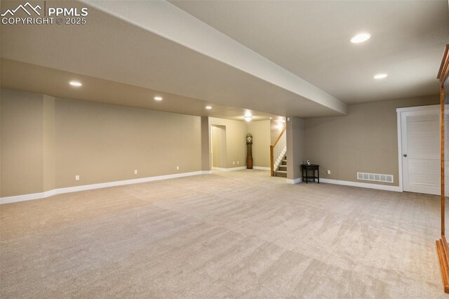 10842 Scenic Brush Dr, Peyton, CO 80831 - finished below grade area with recessed lighting, light carpet, stairs, and baseboards