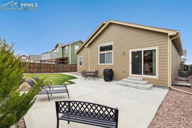 10842 Scenic Brush Dr, Peyton, CO 80831 - rear view of house with entry steps, a patio area, and central air condition unit