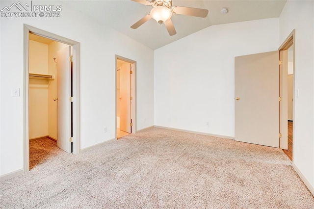 1120 Pipestone Ct, Colorado Springs, CO 80911 - unfurnished bedroom featuring vaulted ceiling, carpet floors, a spacious closet, and baseboards
