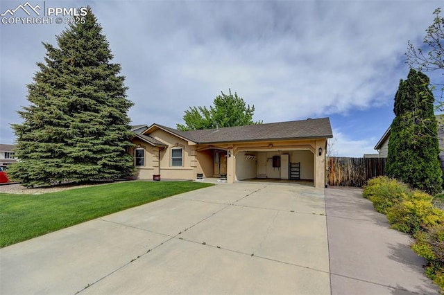 1120 Pipestone Ct, Colorado Springs, CO 80911 - ranch-style house featuring stucco siding, a garage, and driveway