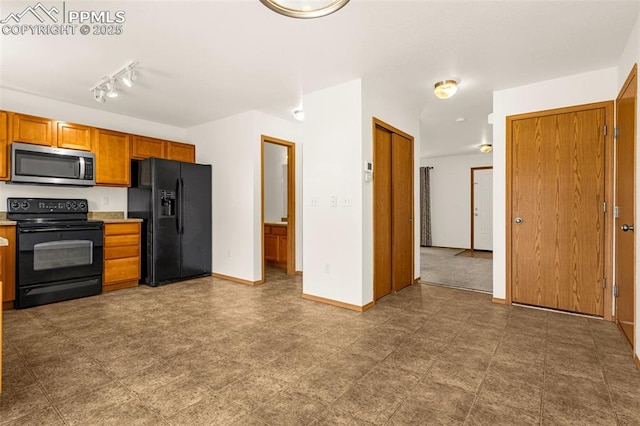 kitchen featuring black appliances, brown cabinets, light countertops, and baseboards