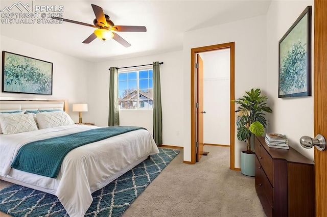 bedroom featuring carpet floors, a ceiling fan, and baseboards