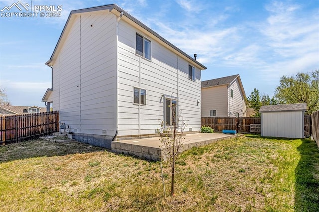 back of property featuring a patio area, a storage shed, and an outbuilding