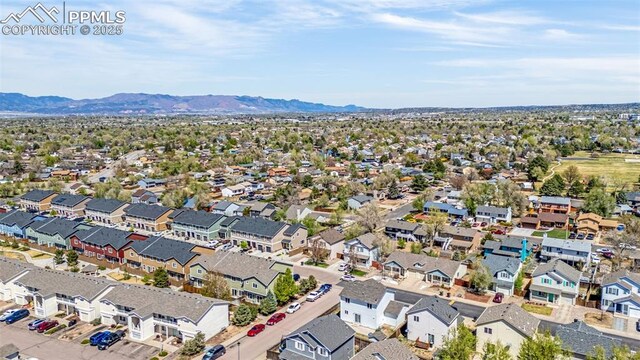 aerial perspective of suburban area with a mountain backdrop
