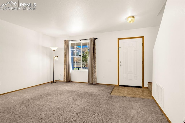 spare room with carpet floors and baseboards