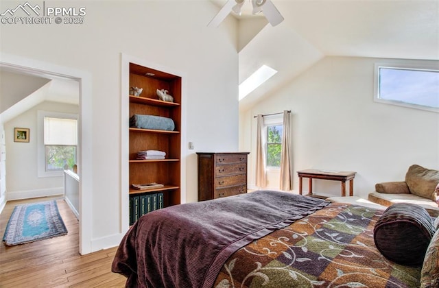 bedroom featuring baseboards, vaulted ceiling, ceiling fan, and wood finished floors
