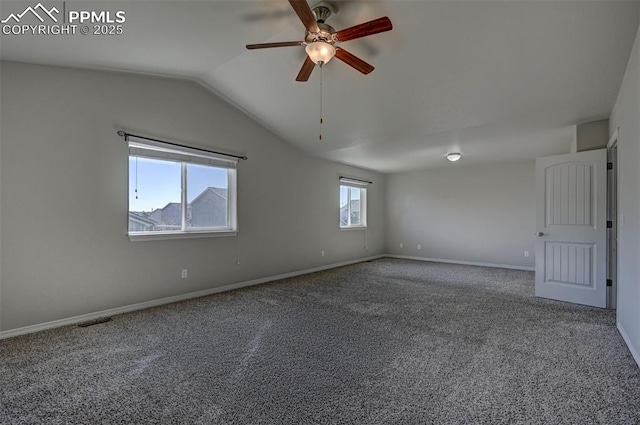 unfurnished room with a ceiling fan, baseboards, carpet flooring, visible vents, and vaulted ceiling